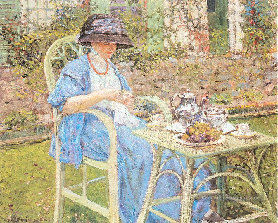 Petit déjeuner au jardin Impressionniste femmes Frederick Carl Frieseke Peintures à l'huile
